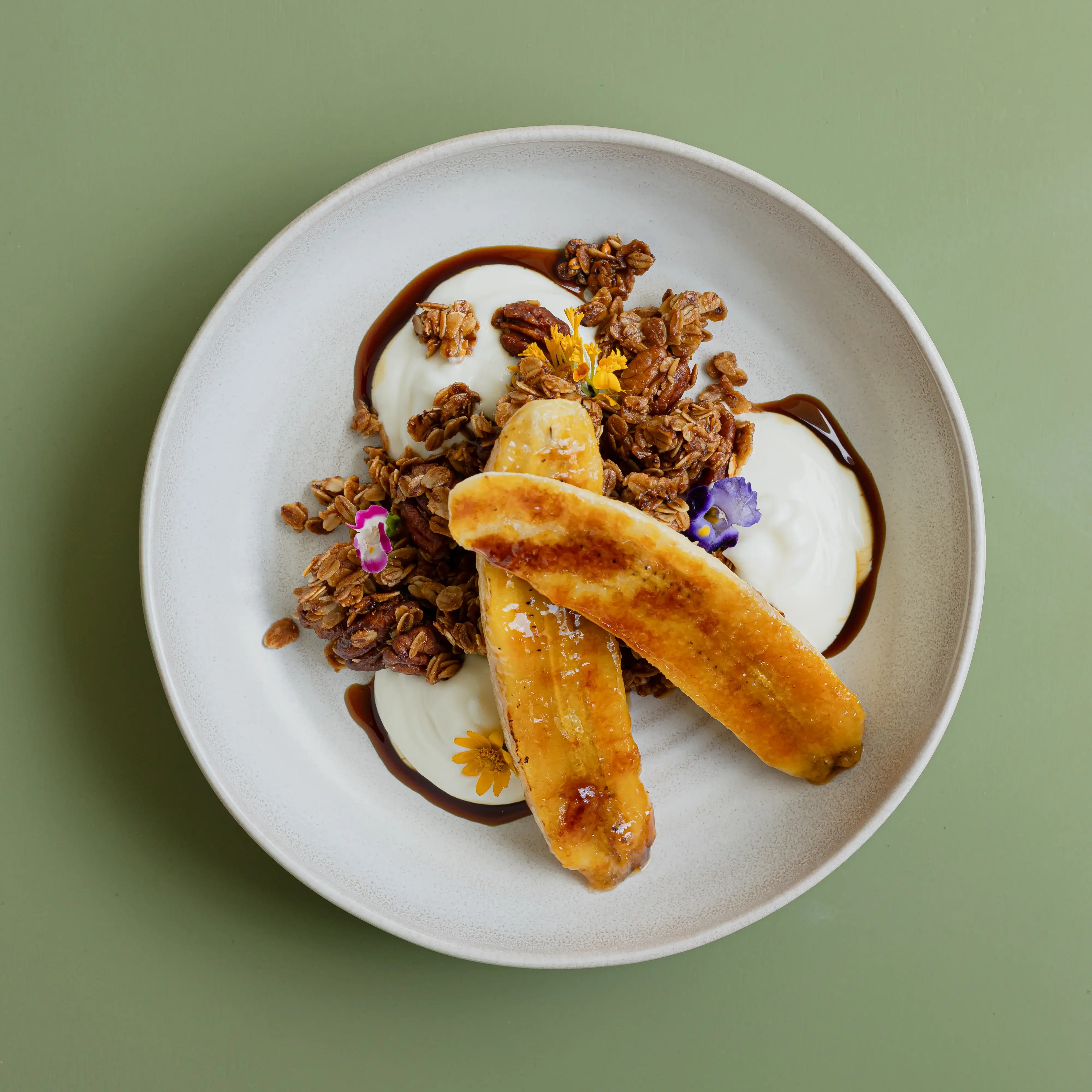 Homemade granola, hung yogurt, brown sugar syrup, caramelized banana